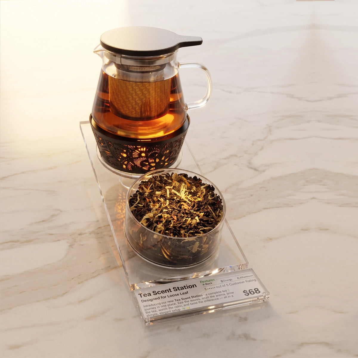Tea Scent Station tea set on a clear acrylic stand, featuring a glass teapot with infuser and metal tea warmer, a Aroma Scent Cup filled with loose-leaf tea, and a small acrylic label plate with printed price/brand card.