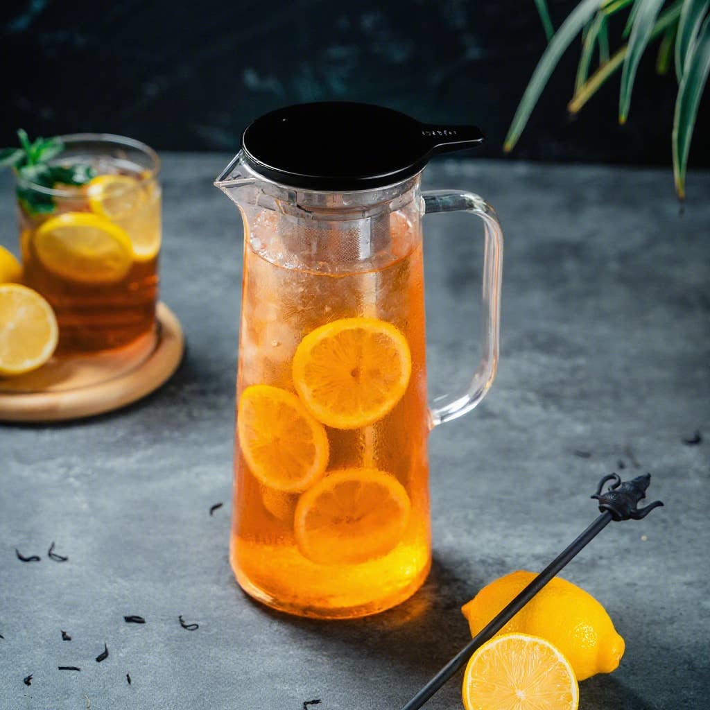 1.5L Glass Iced Tea Jug filled with refreshing iced tea and fruit slices, showcasing a bright summer drink ready for sharing.