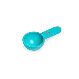 Turquoise measuring perfect cup spoon on a white background
