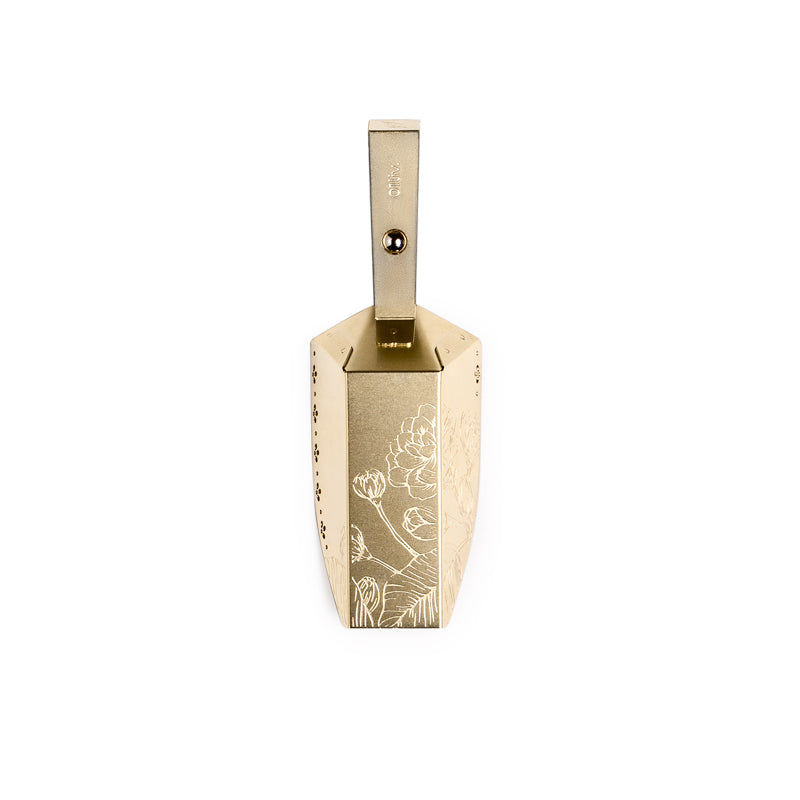 Magnetic Magic-Scoop™ in Gold with integrated magnet and decorative detailing, designed to attach to tea tins for convenient loose-leaf tea measuring.