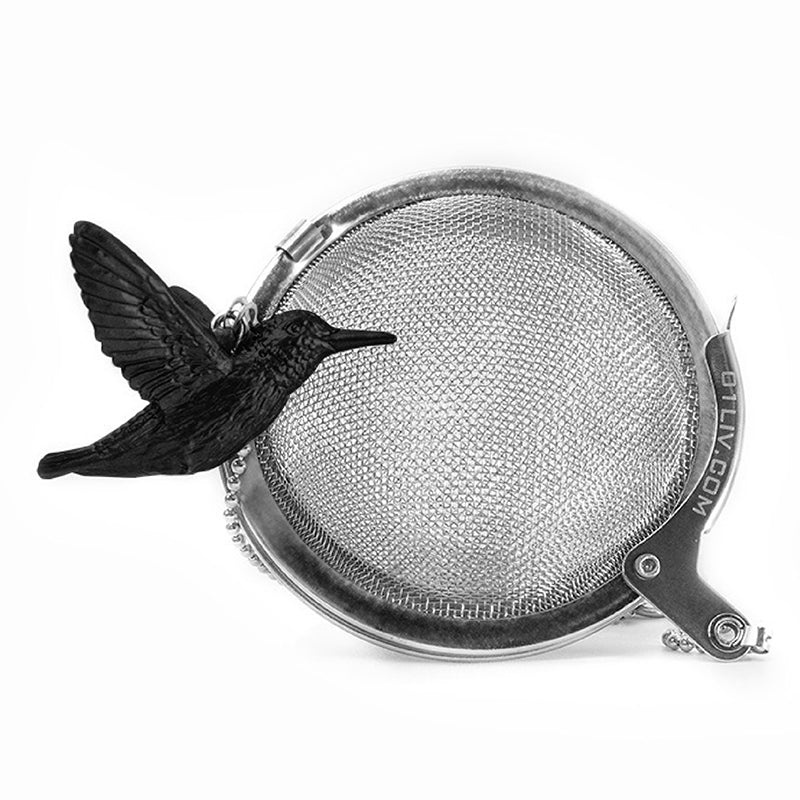 ChiChi Loose Leaf Tea Ball Infuser with Rivoli's Hummingbird Black Charm crafted from 304 food-grade stainless steel with fine mesh, attached chain and decorative charm for easy loose-leaf tea brewing.